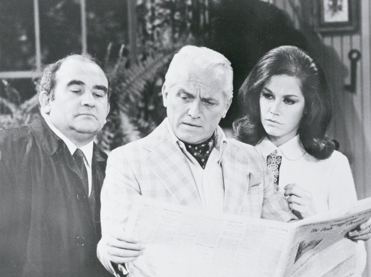 Fictional anchorman Ted Baxter, center, flanked by newsroom boss Lou Grant and colleague Mary Richards, on 'The Mary Tyler Moore Show' in 1970. <a href="https://www.gettyimages.com/detail/news-photo/newsroom-boss-lou-grant-newscaster-ted-baxter-and-mary-news-photo/517428674?phrase=Ted%20Baxter&adppopup=true" rel="nofollow noopener" target="_blank" data-ylk="slk:Bettmann/Getty;elm:context_link;itc:0;sec:content-canvas" class="link ">Bettmann/Getty</a>