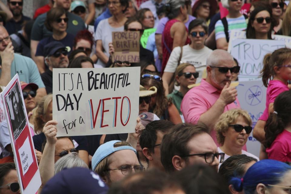 Abortion-rights supporters rally outside the North Carolina Legislative Building in Raleigh, N.C, on Saturday, May 13, 2023, to urge Republican legislators to sustain Democratic Gov. Roy Cooper's veto of new abortion restrictions. (AP Photo/Hannah Schoenbaum)