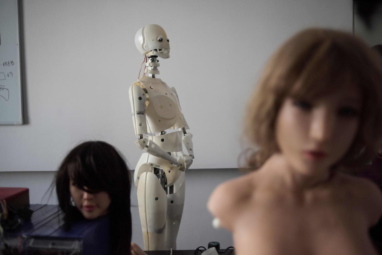 Robots in a lab of a doll factory of EX Doll, a firm based in Dalian, China, Feb. 1, 2018. (Photo: Fred Dufour/AFP/Getty Images)