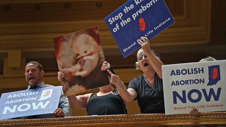 Pro-Life protesters yell down to Pro-Choice protesters at the ACLU rally at the Indiana Statehouse, Monday, July 25, 2022 in Indianapolis, Ind.  Legislators gathered for a special discussion to discuss abortion legislation.