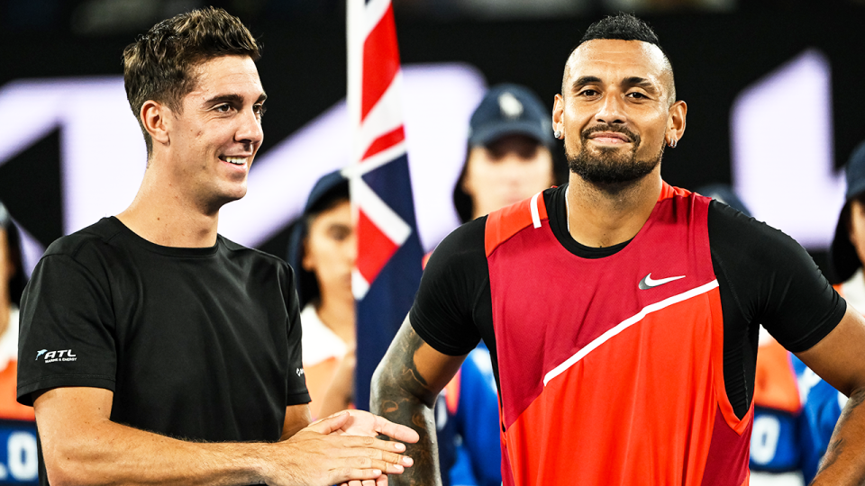 Thanasi Kokkikaniks (pictured left) and Nick Kyrgios (pictured right) smile after winning the Australian Open doubles title.