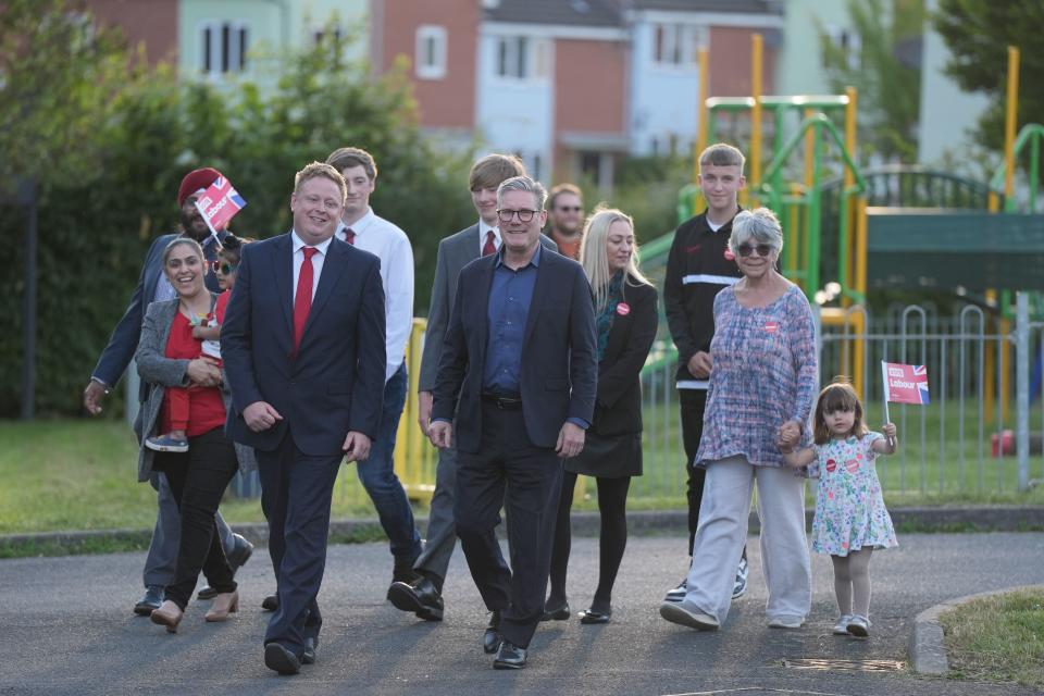 Labour Party leader Sir Keir Starmer, centre, with local parliamentary candidate Chris Bloore and other supporters arriving for a visit to Redditch in Worcestershire (Jacob King/PA) (PA Wire)