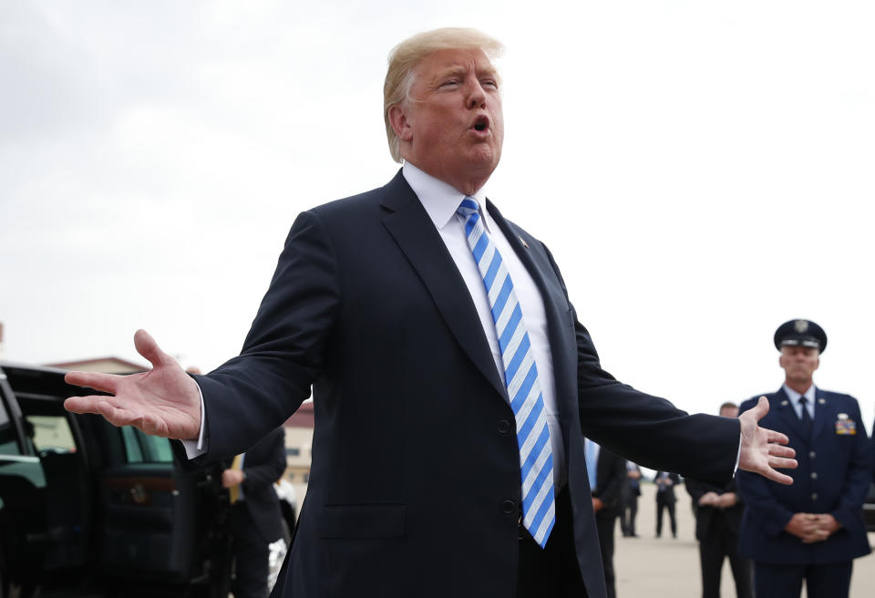 President Donald Trump speaks to the media as he steps off Air Force One, Tuesday, Aug. 21, 2018, in Charleston, W.Va. (AP Photo/Alex Brandon)