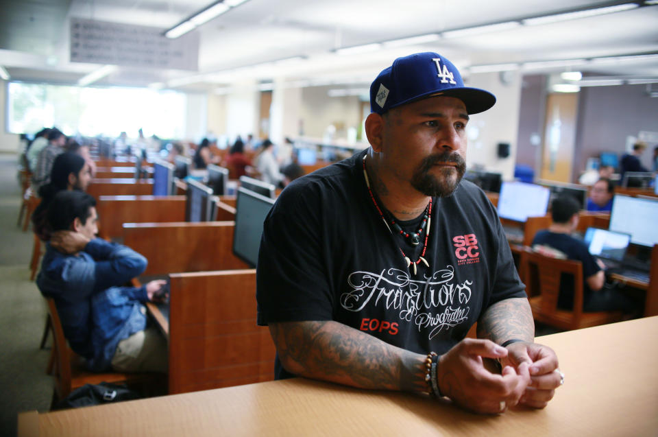 Martin Leyva, who has spent years in prison, is on track to get master’s degree in sociology this spring from California State University San Marcos. He credits education with turning his life around. “We don't let our past crimes define our progress moving forward in life,” he said. (Photo: Sandy Huffaker for Yahoo News)