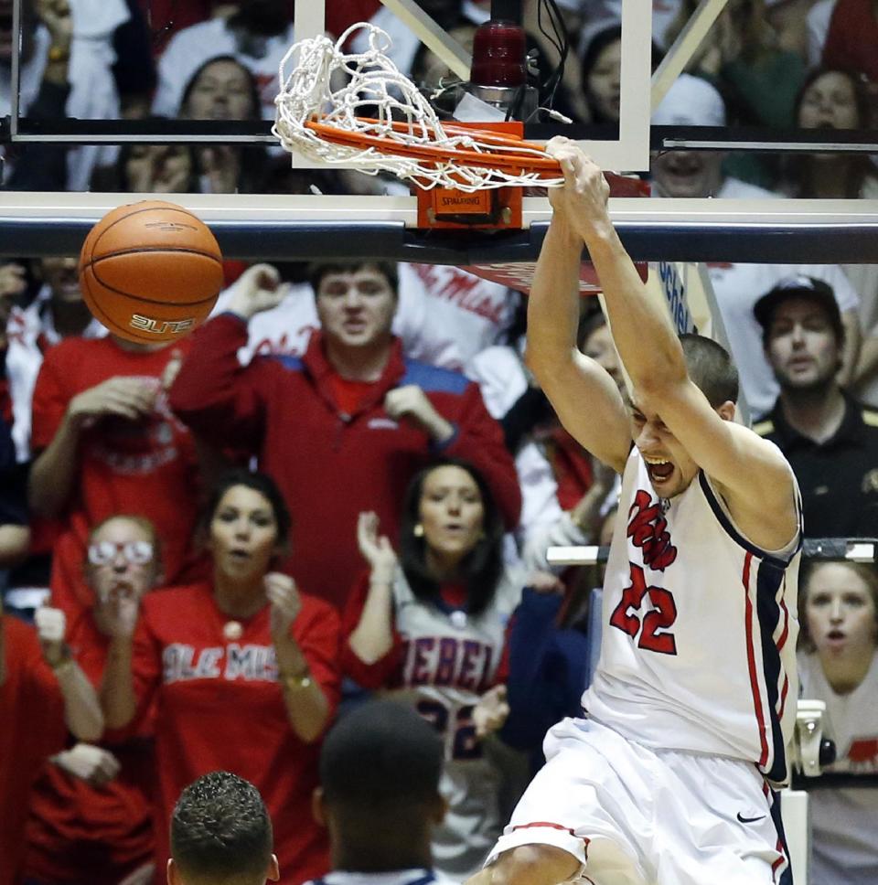 Mississippi guard Marshall Henderson (22) dunks in the first half of an NCAA college basketball game against Florida in Oxford, Miss., Saturday, Feb. 22, 2014. (AP Photo/Rogelio V. Solis)