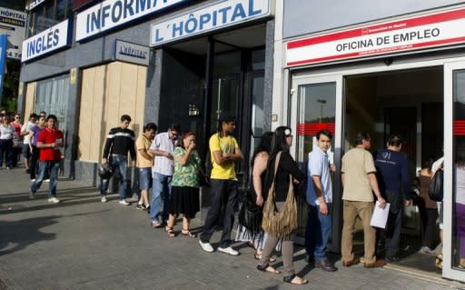 People wait in line at a government employment office in the center of Madrid on June 4. Top European finance ministers vowed Tuesday to respond "speedily" to the continent's debt crisis as Spain pleaded for help for its struggling banking system so as to avoid a full and humbling bailout