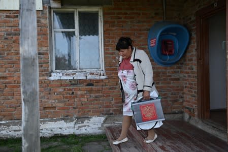 The Wider Image: Russian village's last teacher stays on for her one remaining pupil