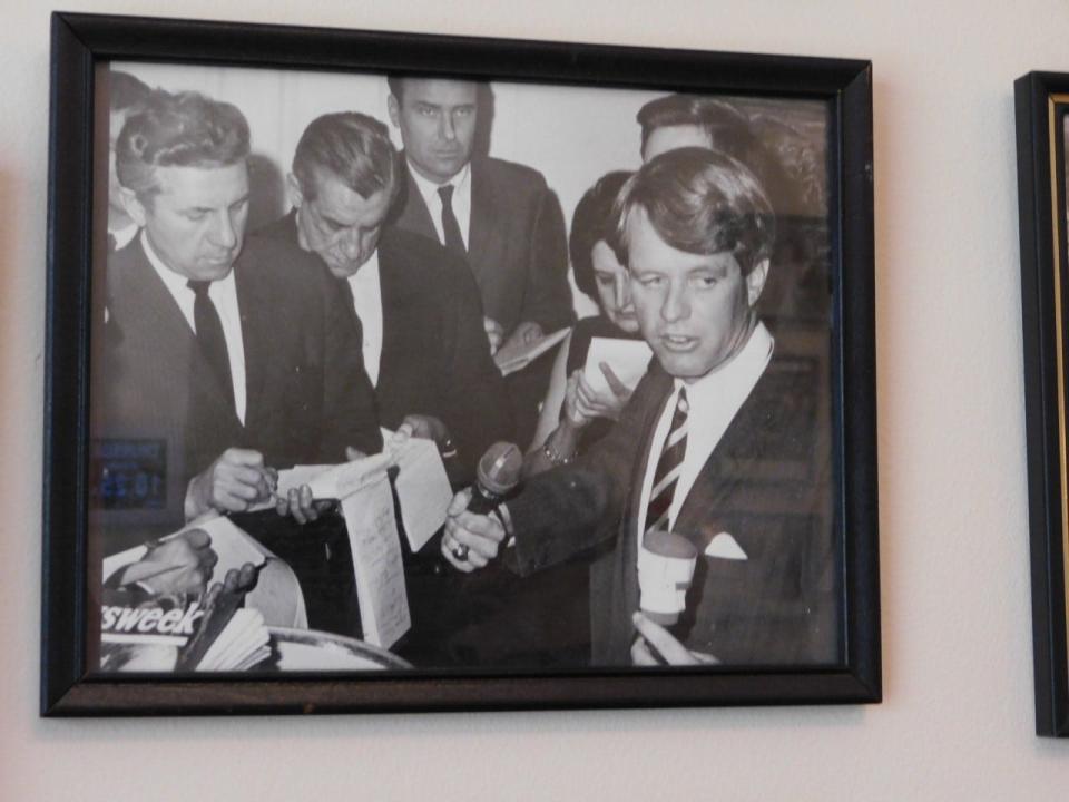 Ted Knap, pictured just opposite former New York Senator Robert Kennedy, covers the former senator's campaign alongside other members of the press.