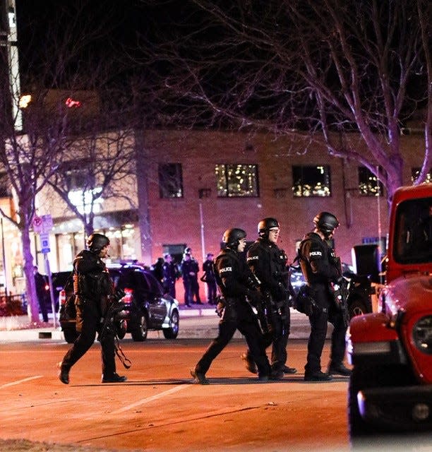 Gentry Trevino captured this photo of Fort Collins police officers responding to a standoff in Old Town Fort Collins, Colo., on Monday, Nov. 29, 2021.