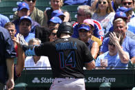 Miami Marlins manager Don Mattingly, left, congratulates Adam Duvall after his two-run home run during the third inning of a baseball game against the Chicago Cubs in Chicago, Saturday, June 19, 2021. (AP Photo/Nam Y. Huh)