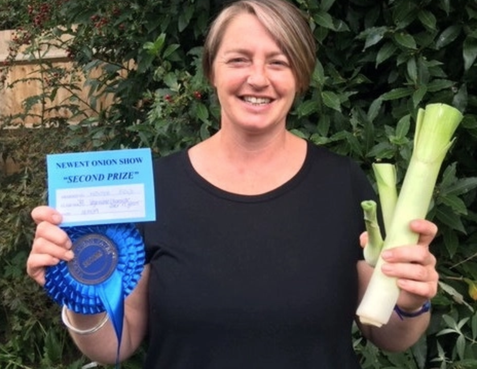 Ms Feld pictured with her second place certificate and rosette. (SWNS)