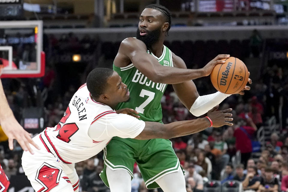 Chicago Bulls' Javonte Green pressures Boston Celtics' Jaylen Brown during the first half of an NBA basketball game Monday, Oct. 24, 2022, in Chicago. (AP Photo/Charles Rex Arbogast)
