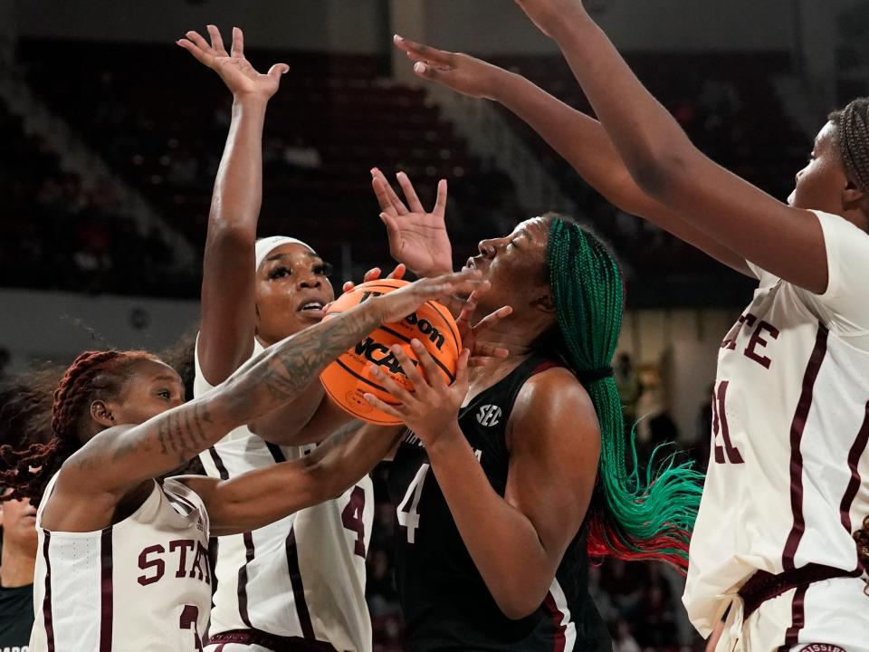 Aliyah Boston faces a triple-team against Mississippi State.