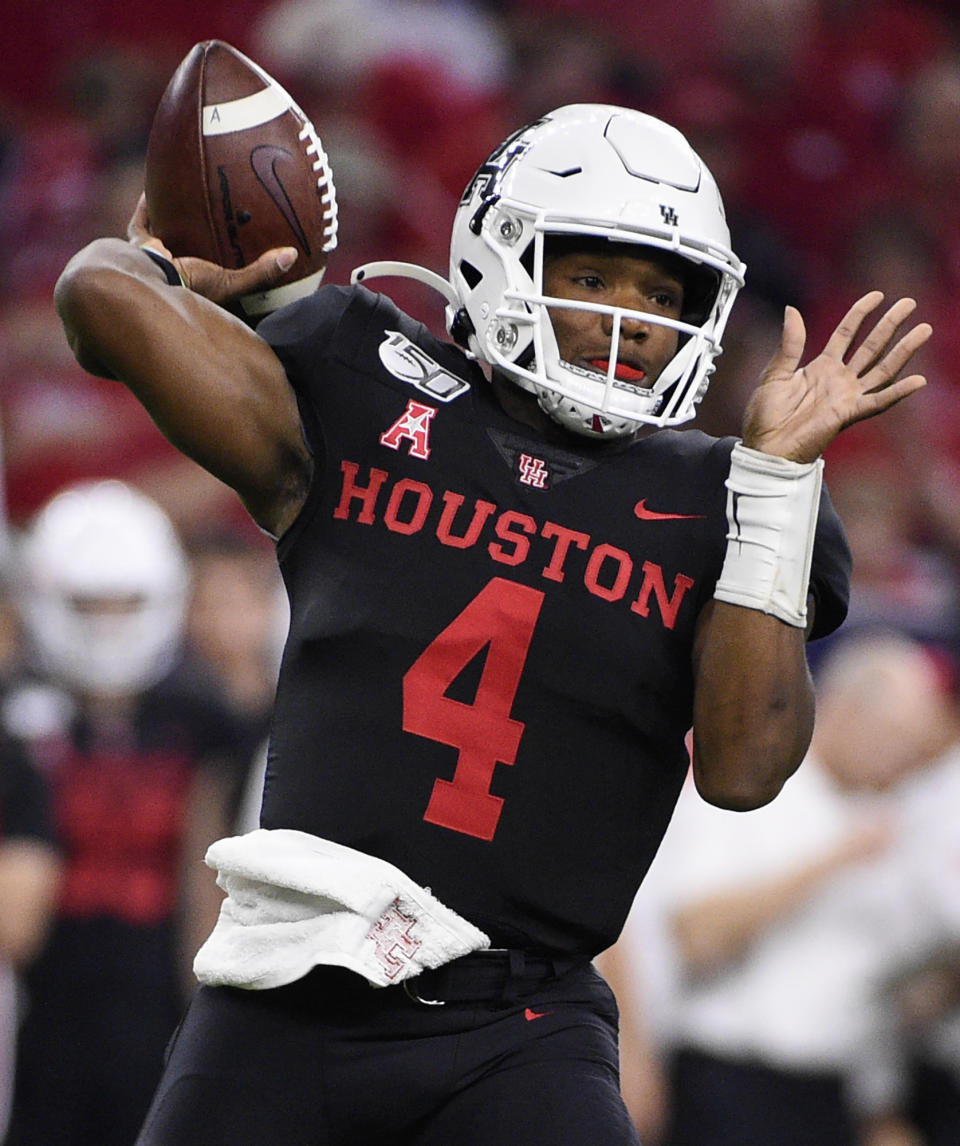 Houston quarterback D'Eriq King throws a pass during the first half of the team's NCAA college football game against Washington State, Friday, Sept. 13, 2019, in Houston. (AP Photo/Eric Christian Smith)