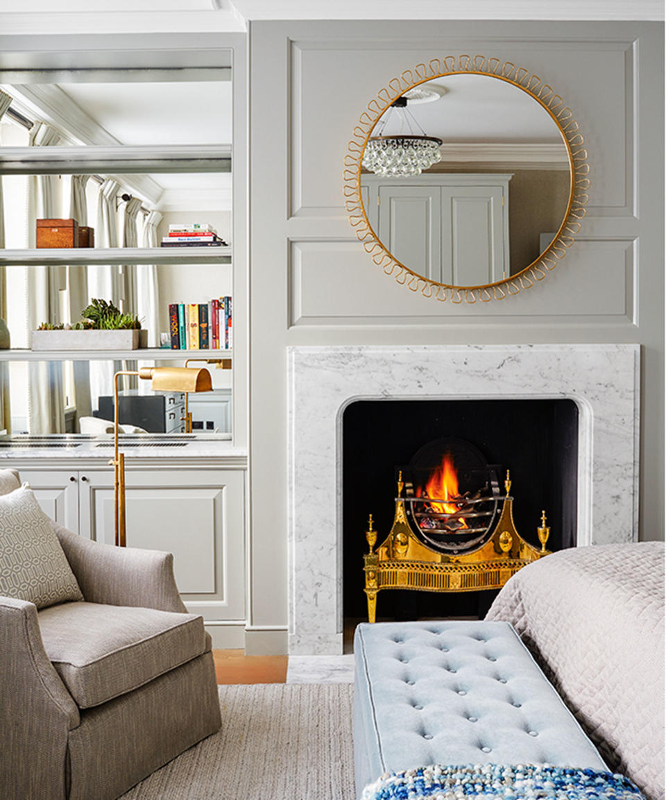 neutral bedroom with alcove shelving with mirrors