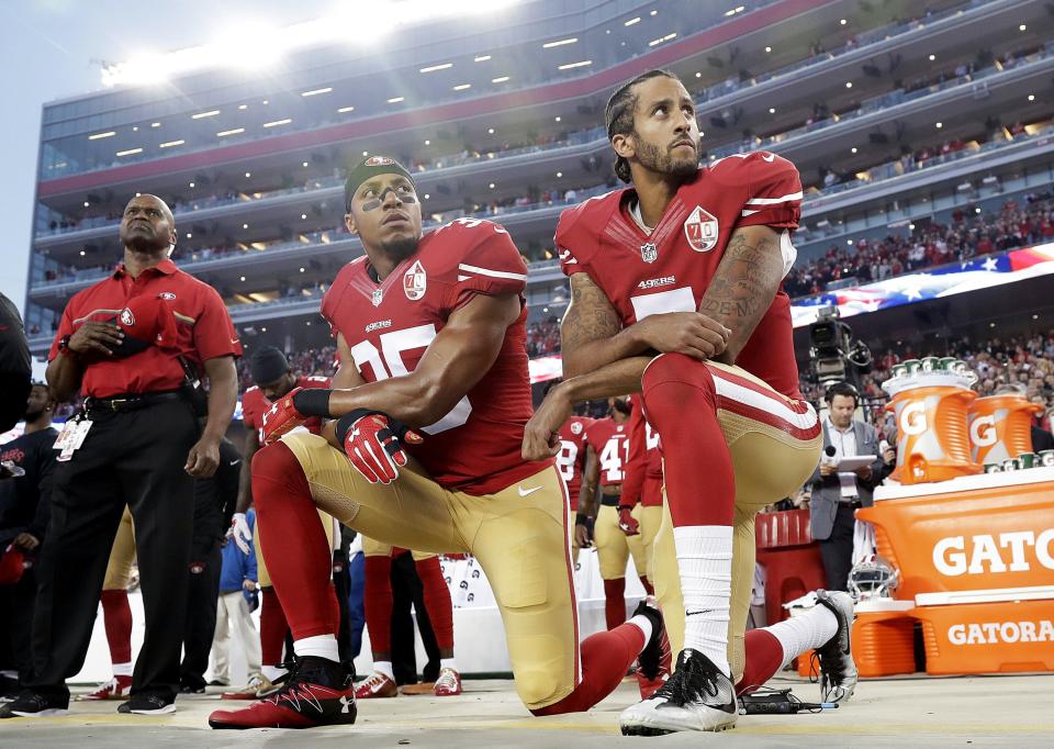 San Francisco 49ers safety Eric Reid (35) and quarterback Colin Kaepernick kneel during the national anthem before a game in September 2016 against the Los Angeles Rams in Santa Clara, Calif.