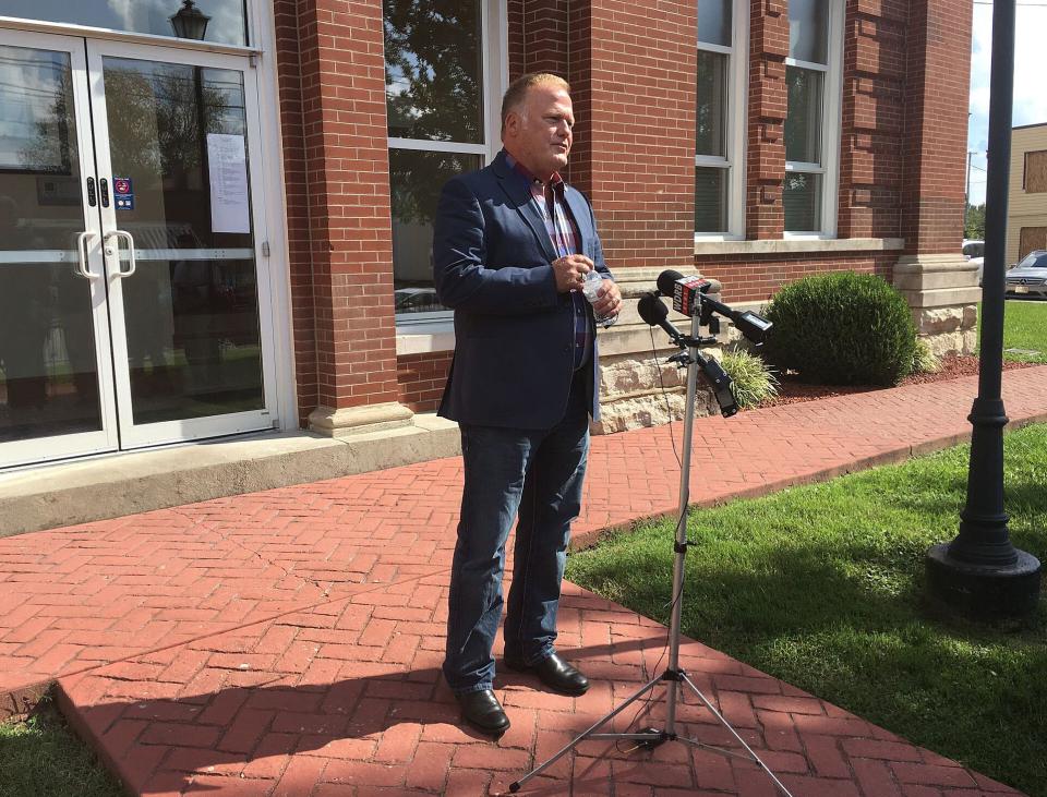 Kentucky state Rep. Dan Johnson speaks during a news conference outside the Bullitt County courthouse in Shepherdsville, Ky.