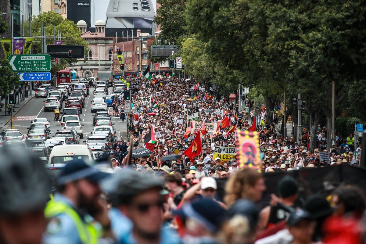  Demonstrators march towards Victoria Park during an Invasion Day protest  (Getty Images)