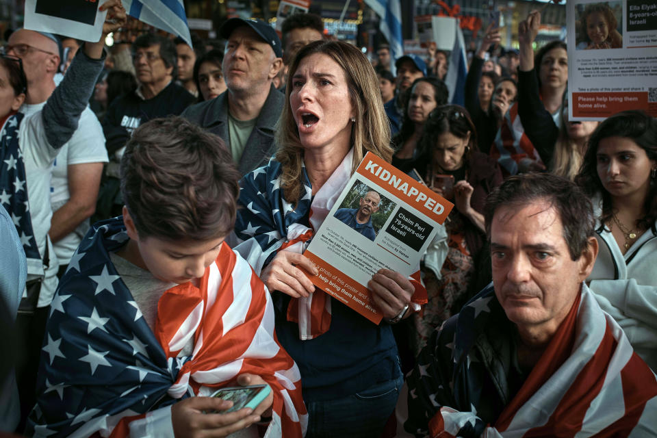 Pro-Israel supporters gather to demand the immediate release of all hostages held by Hamas during a demonstration at Times Square on Thursday, Oct. 19, 2023, in New York. (AP Photo/Andres Kudacki)