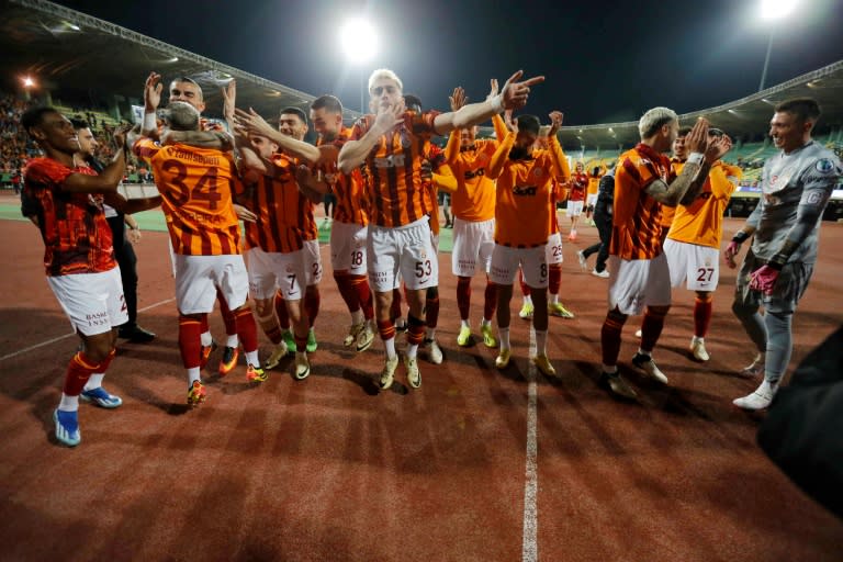 Galatasaray's players celebrating after winning the Turkish Super Cup final after the Fenerbahce team walked off the pitch (-)