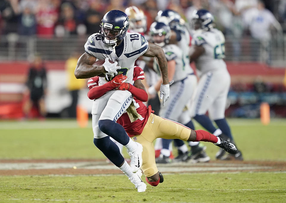 SANTA CLARA, CALIFORNIA - NOVEMBER 11: Wide receiver Josh Gordon #10 of the Seattle Seahawks is tackled by the defense of the San Francisco 49ers in the game at Levi's Stadium on November 11, 2019 in Santa Clara, California. (Photo by Thearon W. Henderson/Getty Images)