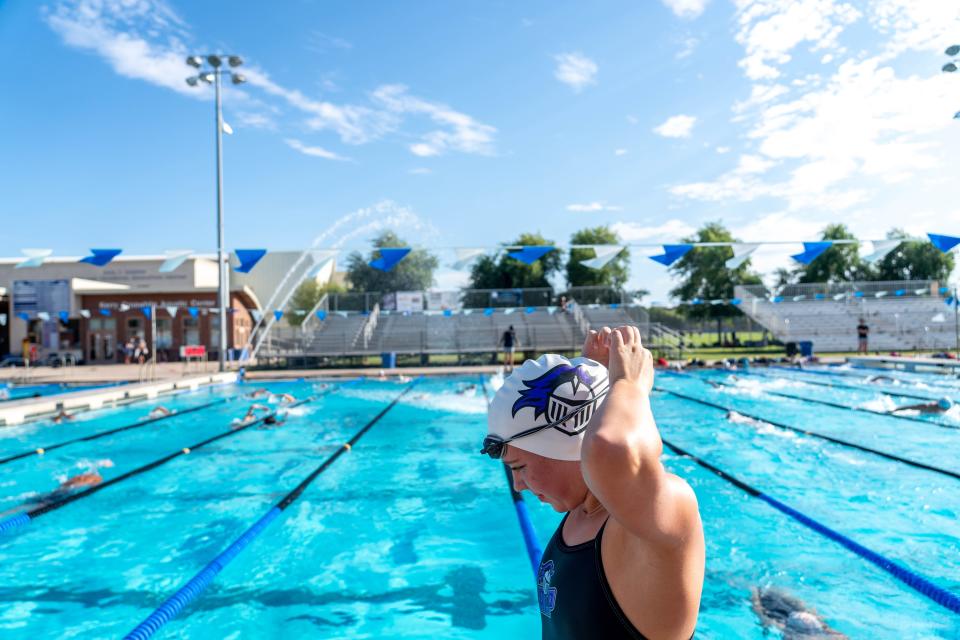 Ashlyn Tierney, 14, a freshman student athlete on Arizona College Prep’s swim team, prepares to swim during a practice at Chandler High School’s Kerry Croswhite Aquatic Center in Chandler on September 20, 2022.