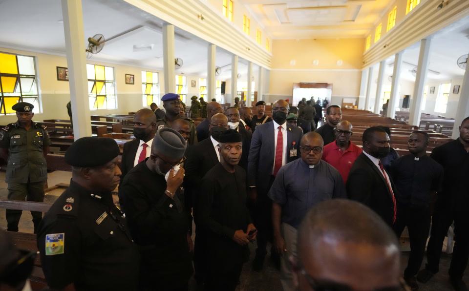 Nigeria's Vice President, Yemi Osinbajo, centre, visits the St. Francis Catholic Church in Owo Nigeria, Monday, June 6, 2022. The gunmen who killed 50 people at a Catholic church in southwestern Nigeria opened fire on worshippers both inside and outside the building in a coordinated attack before escaping the scene, authorities and witnesses said Monday. (AP Photo/Sunday Alamba)