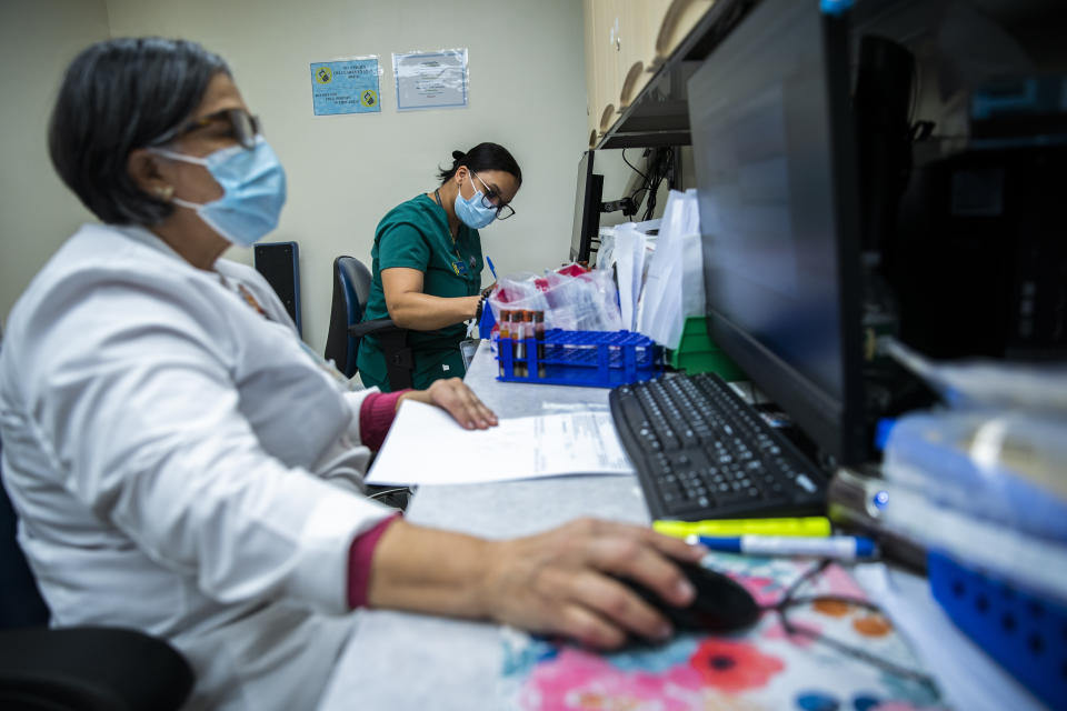 Nurses work at El Nuevo San Juan Health Center in the Bronx borough in New York, Thursday, Jan. 11, 2024. (AP Photo/Eduardo Munoz Alvarez)