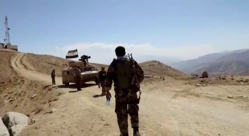 Humvee with National Resistance Front flag is seen in front of a radio mast near Panjshir Valley