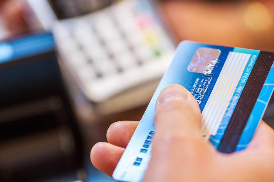 Paris, France - October 08, 2015: Close-up of female hand doing purchase through payment machine