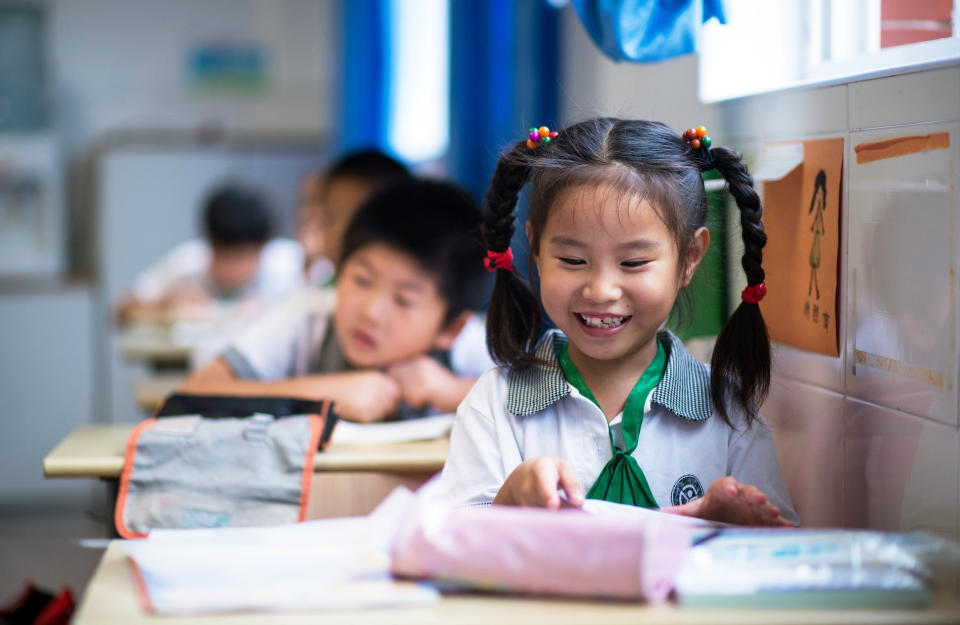 Chinese children attend a class at the Jinqao Center Primary School in Shanghai on September 1, 2014. 