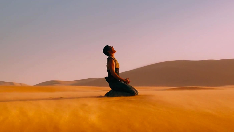 Furiosa screams in the desert in Mad Max: Fury Road.