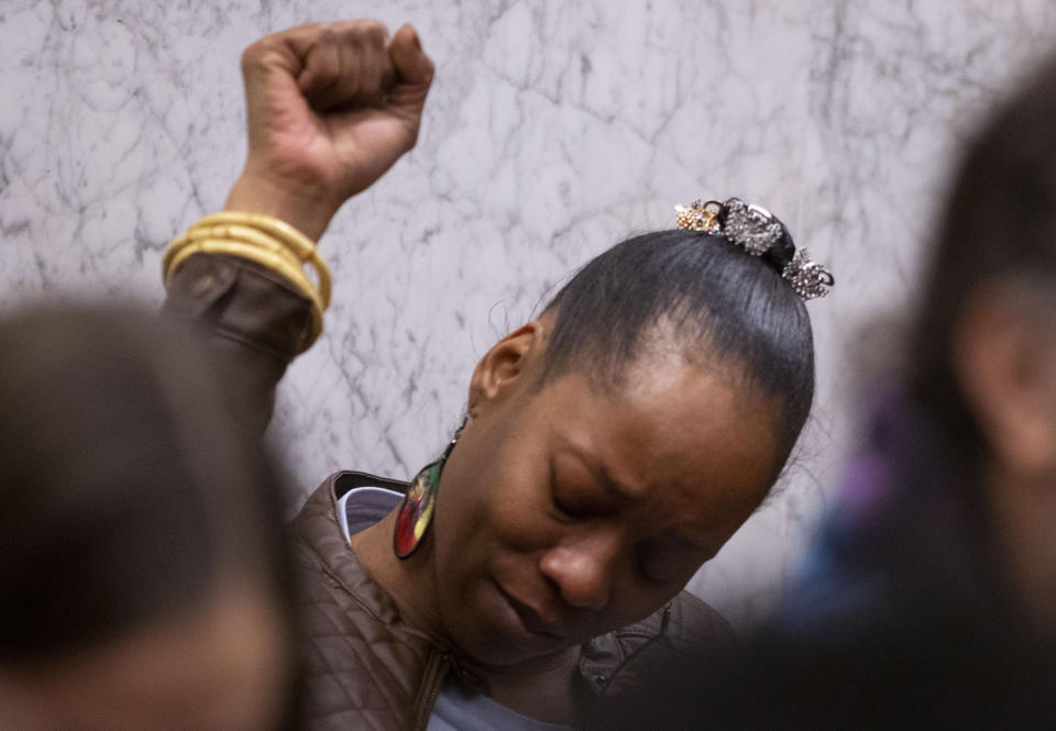 FILE - In this Feb. 20, 2020, file photo, Demetria Hester reacts to verdicts of guilty on all twelve counts at the Jeremy Christian trial in Portland, Ore. One of the protesters arrested in Portland, Oregon early Monday, Aug. 10, 2020, is a Black woman who was assaulted by a white supremacist in a high-profile case three years ago and who now leads a group of "moms" in racial justice protests each night. Hester, 46, was booked on suspicion of disorderly conduct and interfering with a police officer during a protest that began Sunday night and stretched into the early morning hours. (Beth Nakamura/The Oregonian via AP, Pool, File)