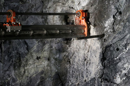 Water pours out as an electric jumbo drill operates at Goldcorp Inc's Borden all-electric underground gold mine near Chapleau, Ontario, Canada, June 13, 2018. REUTERS/Chris Wattie