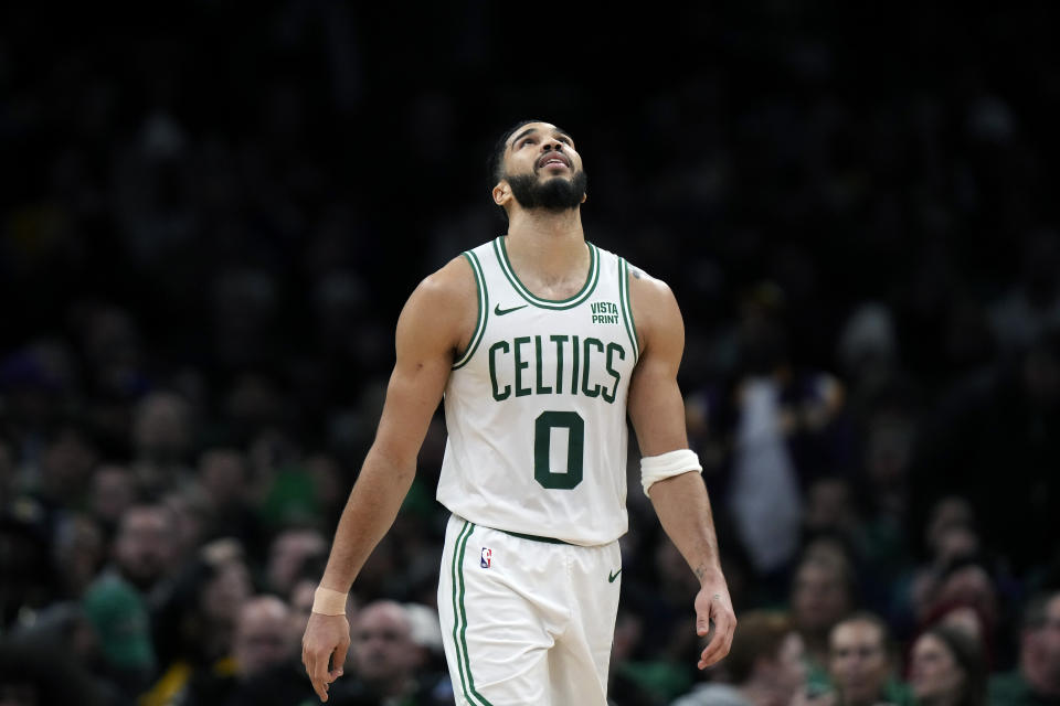 Boston Celtics forward Jayson Tatum looks up as the Celtics trail the Los Angeles Lakers in the second half of an NBA basketball game, Thursday, Feb. 1, 2024, in Boston. (AP Photo/Steven Senne)