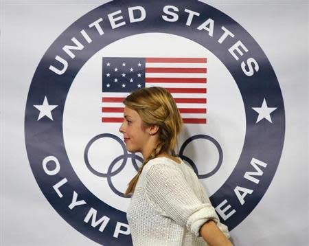 Figure skater Ashley Wagner walks offstage after being introduced as part of the United States' women's figure skating team for the upcoming Sochi Winter Olympics, during a news conference at the U.S. Figure Skating Championships in Boston, Massachusetts January 12, 2014. REUTERS/Brian Snyder