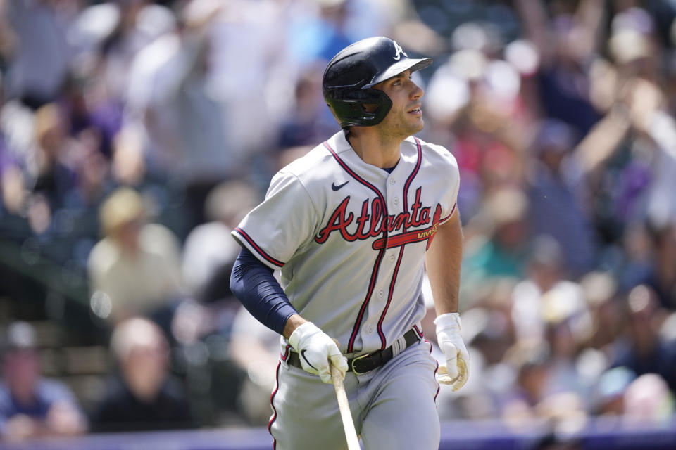 Atlanta Braves' Matt Olson follows the flight of his three-run home run off Colorado Rockies starting pitcher Ryan Feltner in the second inning of a baseball game, Sunday, June 5, 2022, in Denver. (AP Photo/David Zalubowski)