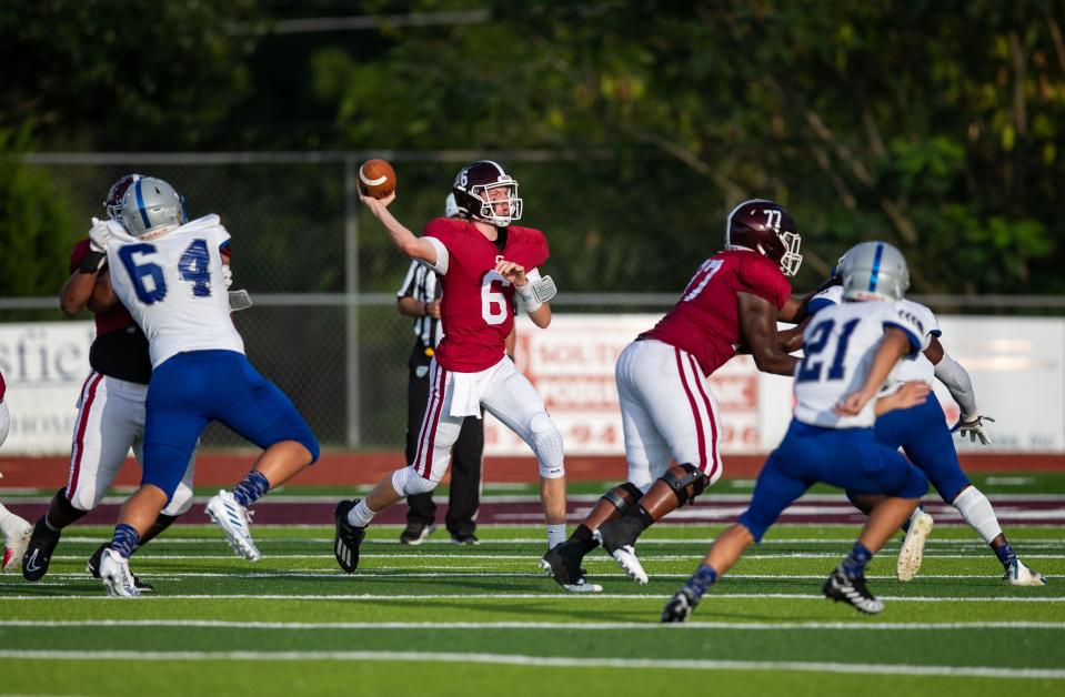 Chiles quarterback Trent Hartung (6) passes to his teammate. The Chiles Timberwolves hosted the Sebastian River Sharks on Friday, Aug. 19, 2022.