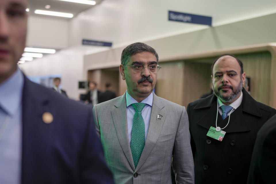 Pakistan's caretaker Prime Minister Anwaar-ul-Haq Kakar, centre, leaves after his speech at the Annual Meeting of World Economic Forum in Davos, Switzerland, Wednesday, Jan. 17, 2024. The annual meeting of the World Economic Forum is taking place in Davos from Jan. 15 until Jan. 19, 2024.(AP Photo/Markus Schreiber)
