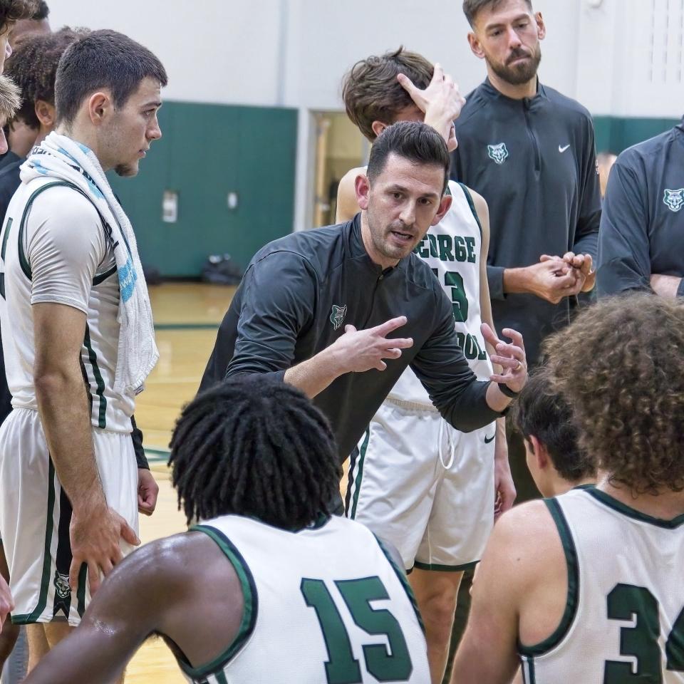 George School coach Ben Luber talks to his team during a timeout.