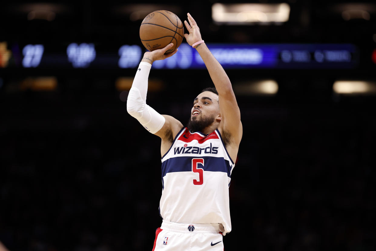 PHOENIX, ARIZONA - DECEMBER 17: Tyus Jones #5 of the Washington Wizards attempts a shot during the game against the Phoenix Suns at Footprint Center on December 17, 2023 in Phoenix, Arizona. The Suns defeated the Wizards 112-108. NOTE TO USER: User expressly acknowledges and agrees that, by downloading and or using this photograph, User is consenting to the terms and conditions of the Getty Images License Agreement.  (Photo by Chris Coduto/Getty Images)