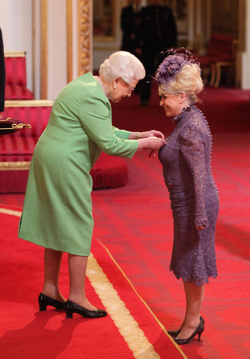 Television star Barbara Windsor is made a Dame Commander of the order of the British Empire by Queen Elizabeth II during an Investiture ceremony at Buckingham Palace. PRESS ASSOCIATION Photo. Picture date: Tuesday March 22, 2016. She received her award for her services to charity and entertainment. See PA story ROYAL Investiture. Photo credit should read: Jonathan Brady/PA Wire