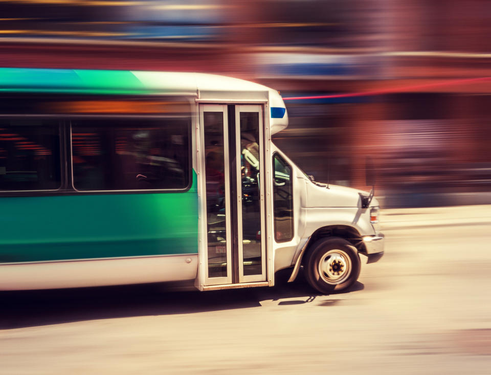 A shuttle bus in motion.