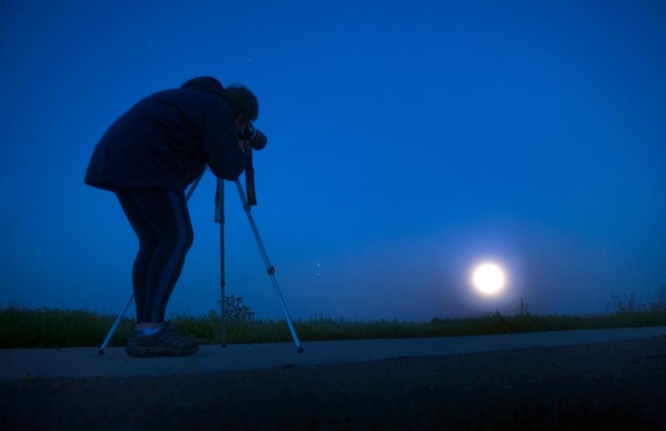 Jean Finley of Galt photographs a supermoon graced the sky over the Cosumnes River Preserve near Thornton early Monday morning on Nov. 14, 2016.