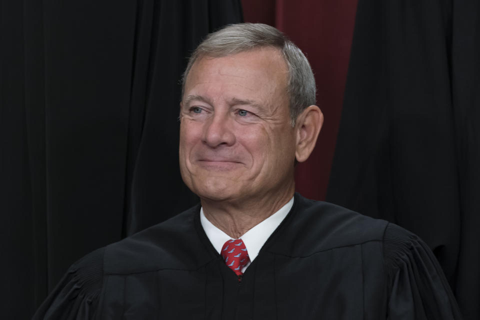 FILE - Chief Justice of the United States John Roberts joins other members of the Supreme Court as they pose for a new group portrait, at the Supreme Court building in Washington, Oct. 7, 2022. Roberts has declined an invitation to meet with Democratic senators to talk about Supreme Court ethics and the controversy over flags that flew outside homes owned by Justice Samuel Alito. (AP Photo/J. Scott Applewhite, File)