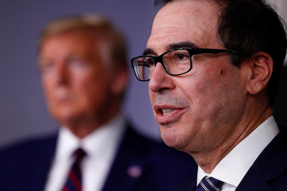 Treasury Secretary Steven Mnuchin addresses the daily coronavirus response briefing as U.S. President Donald Trump listens at the White House in Washington, U.S., April 2, 2020. REUTERS/Tom Brenner