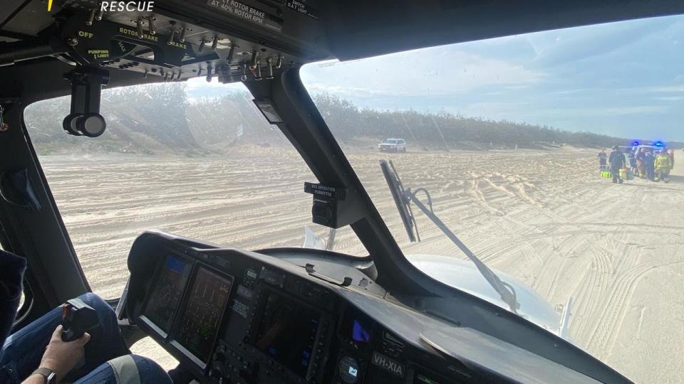 The RACQ LifeFlight Rescue helicopter crew was called to the remote beach scene. Picture RACQ LifeFlight