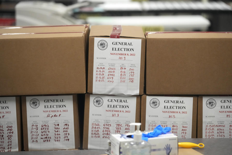 FILE - Ballots from the general election are boxed up at the Maricopa County Recorders Office in Phoenix, Monday, Nov. 14, 2022. On Friday, Dec. 9, The Associated Press reported on stories circulating online incorrectly claiming uncounted ballots that got mixed with counted ballots at voting sites in Arizona’s Maricopa County were not included in the final midterm election results. (AP Photo/Ross D. Franklin, File)