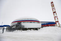 A soldier stands at a central atrium called the "Arctic Trefoil" on the Alexandra Land island near Nagurskoye, Russia, Monday, May 17, 2021. Once a desolate home mostly to polar bears, Russia's northernmost military outpost is bristling with missiles and radar and its extended runway can handle all types of aircraft, including nuclear-capable strategic bombers, projecting Moscow's power and influence across the Arctic amid intensifying international competition for the region's vast resources. (AP Photo/Alexander Zemlianichenko)