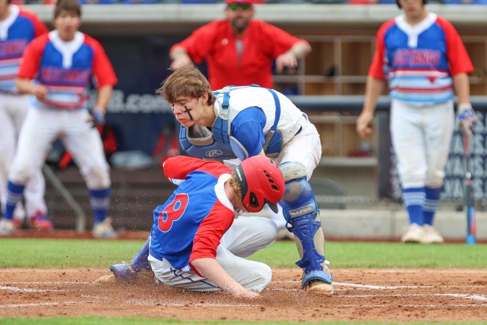 Claude’s Caden McLaulin (8) slides in under a tag in a 1A Regional Semifinals game against Nazareth, May 18, 2023, at Hodgetown, in Amarillo, Texas.  Nazareth won 8-4.